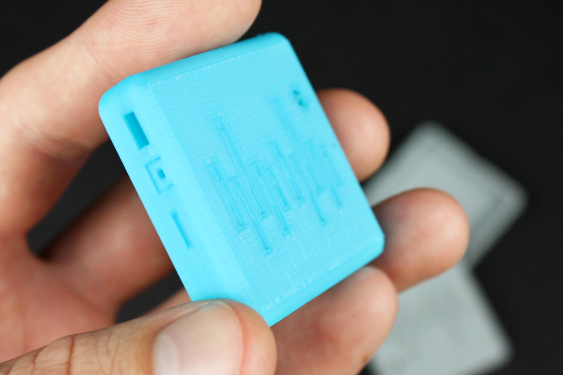 A blue 3D printed electronics housing