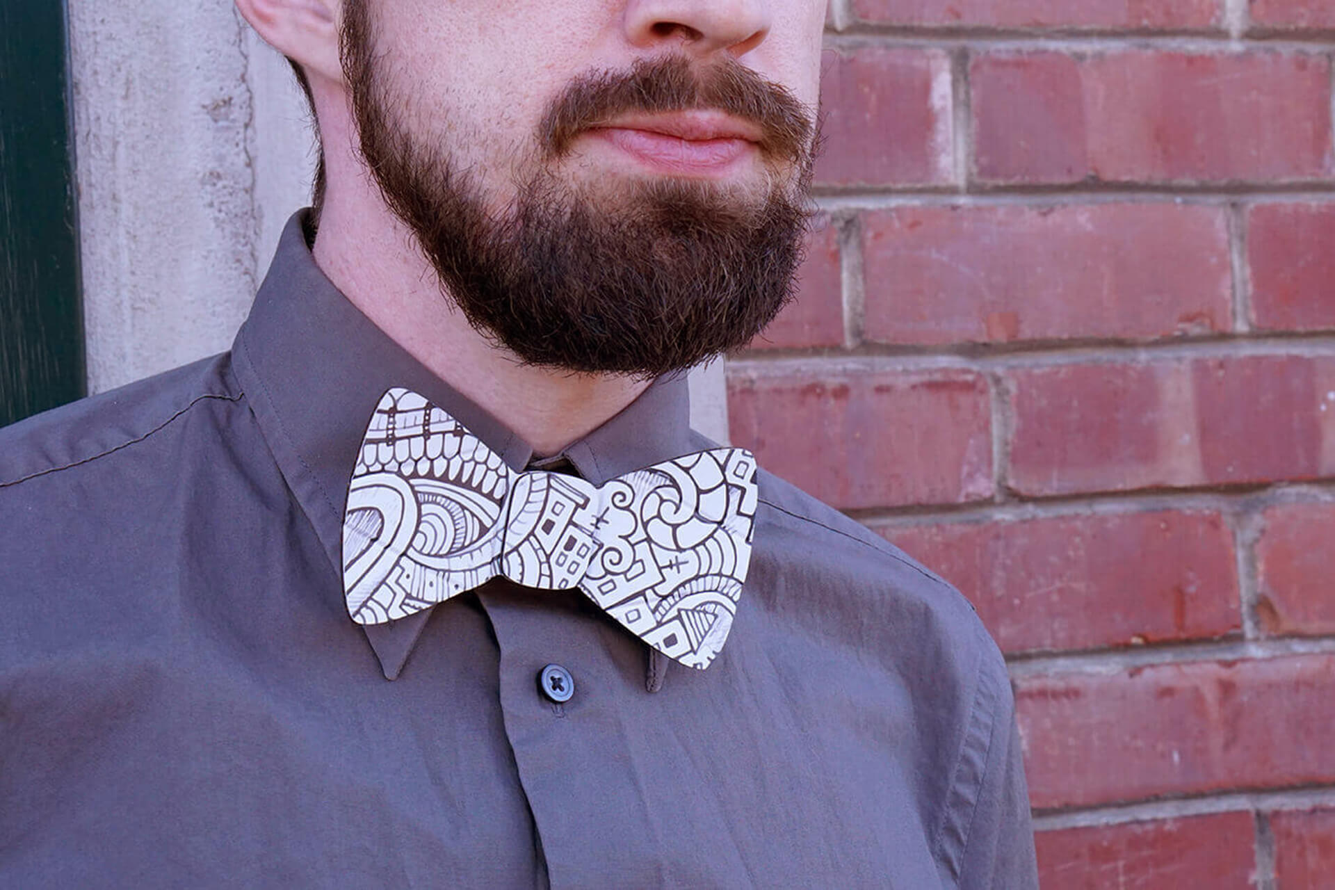 A lifestyle shot of the cardboard doodle bow tie